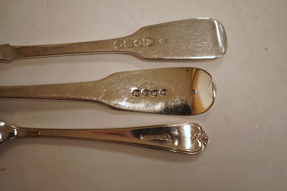 A 19th century matched part canteen of 19th century silver fiddle pattern flatware including a soup ladle and a sauce ladle, twelve table spoons, eight table forks, eight dessert forks, eight dessert spoons and six teasp